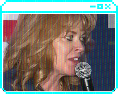 Stacy Garrity speaking at a microphone